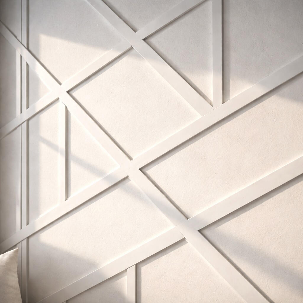 Close up of geometric 3D accent wall with white trim, Venetian plaster texture and natural sunlight in Fort Lauderdale bedroom